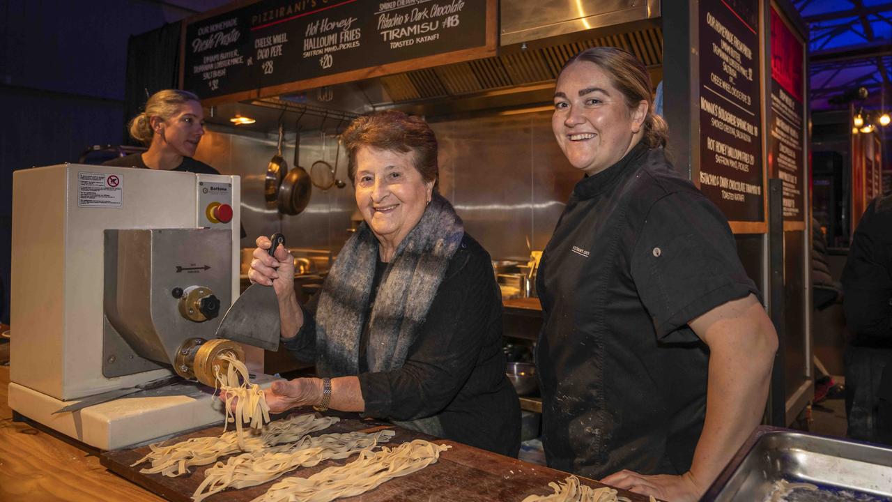 Liv Pizzirani-Rand owner on right with nonna Dina Pizzirani at Pizzirani's Cucina at Winter Feast 2025 in Hobart. Picture: Caroline Tan