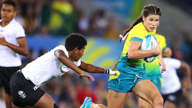 Charlotte Caslick of Australia breaks away to score a try. Picture: Getty Images