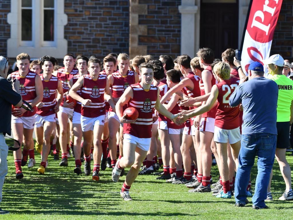 Prince Alfred players run out for the intercol game against St Peter’s at Prince Alfred College on Saturday. Picture: AAP/ Keryn Stevens.