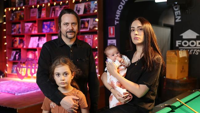 Owner Trad Nathan and wife Tyla with daughters Winter and baby Billie at Leichhardt punk and metal venue Crowbar in Sydney’s inner west. Picture: John Feder