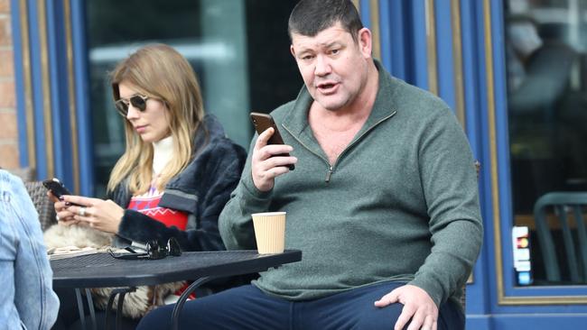 The Wynn deal may have fallen over, but James Packer, seen here is Aspen with Kylie Lim, isn’t prepared to give up the business world just yet, although he does want a simpler life. Picture: Nemo/Backgrid