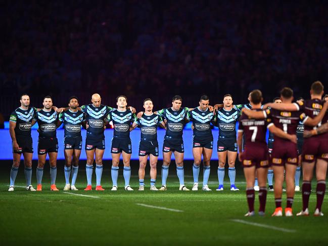 Players are seen lined up for the national anthem before Game 2 of the 2019 State of Origin series between the Queensland Maroons and the New South Wales Blues at Optus Stadium in Perth, Sunday, June 23, 2019. (AAP Image/Darren England) NO ARCHIVING, EDITORIAL USE ONLY