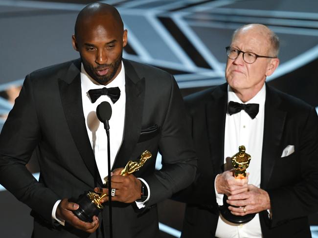 Kobe Bryant and Glen Keane accept Best Animated Short Film for Dear Basketball. Picture: Getty Images