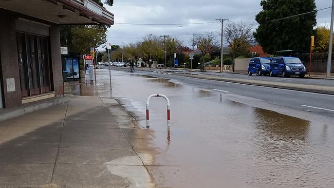 A burst water main is flooding Henley Beach Rd, threatening businesses and slowing traffic. Picture: Brunch on Henley