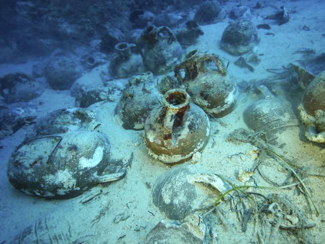 This undated handout photo provided by the Greek Culture Ministry on Monday, Oct. 15 , 2018, showing items on the seabed from an ancient shipwreck discovered off the island of Fourni.  Greece's culture ministry says a Greek-U.S. team has located traces of five more ancient shipwrecks in the eastern Aegean Sea, raising to 58 the number of wrecks located since 2015 around Fourni, a notoriously dangerous point on the ancient shipping route. (Greek Culture Ministry via AP)