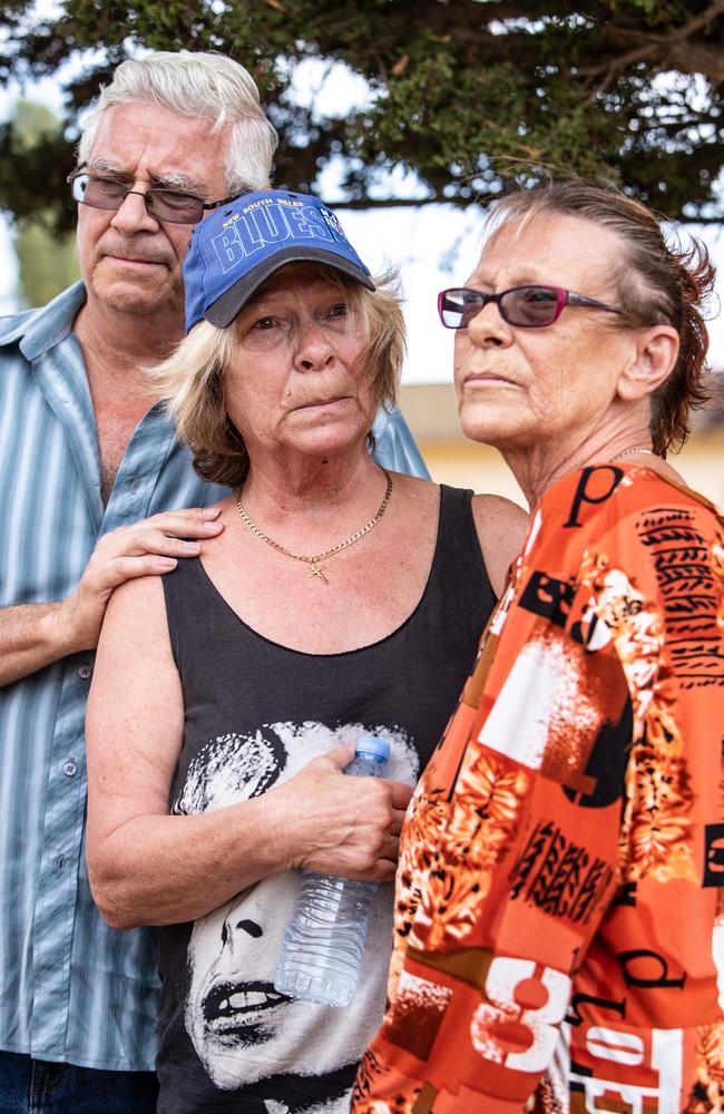 Lesley Newman (in baseball cap) with her twin sister Kim Blythe and friend John speaks to the media today. Picture: Julian Andrews