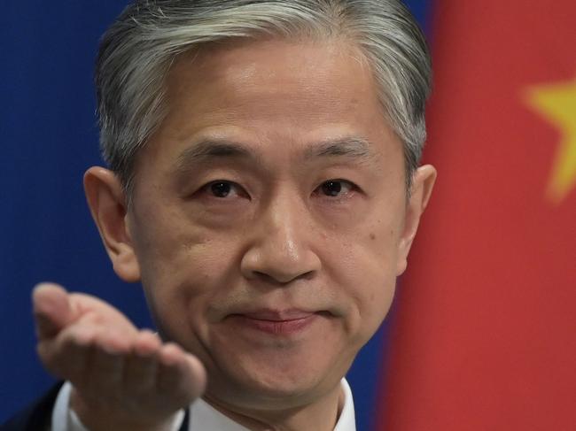 Chinese Foreign Ministry spokesman Wang Wenbin takes a question at the Foreign Ministry briefing in Beijing on November 9, 2020. (Photo by GREG BAKER / AFP)