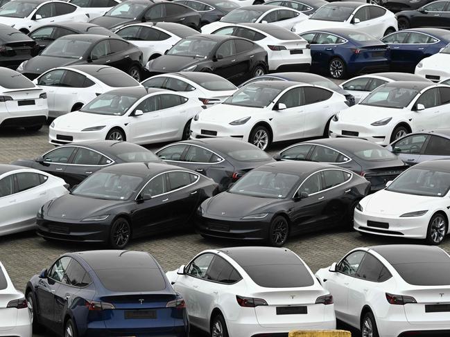 Tesla electric cars are stationed in a storage area in the Zeebrugge port, northern Belgium on June 21, 2024. (Photo by JOHN THYS / AFP)