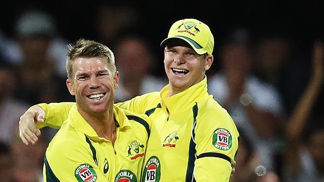 Australia's David Warner celebrates with Steve Smith after taking a catch to dismiss Pakistan's Shoaib Malik off the bowling of Australia's Travis Head during the One Day International cricket match between Australia and Pakistan at the SCG. Picture: Brett Costello