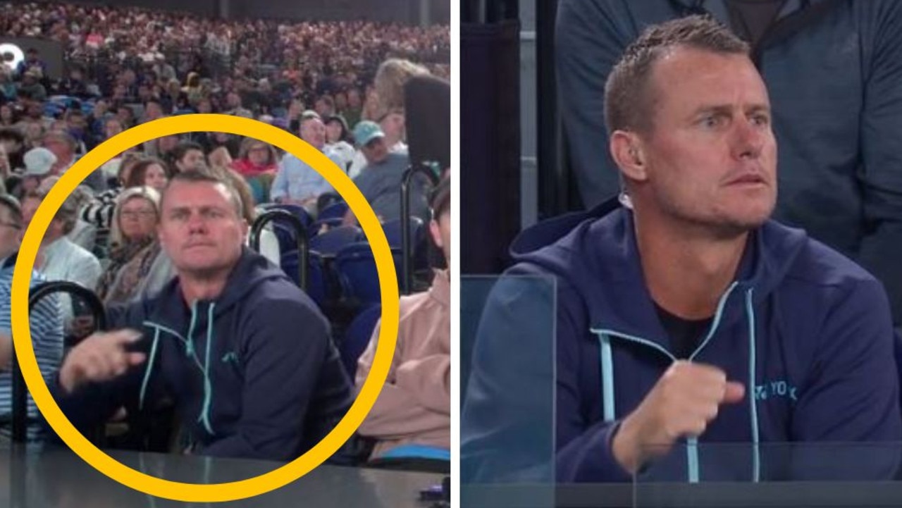 Lleyton Hewitt reacts after being caught on the big screen