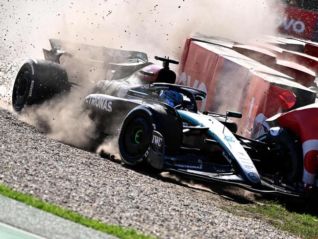 Mercedes' British driver George Russell skids through the gravels after a crash during the Australian Formula One Grand Prix at Albert Park Circuit in Melbourne on March 24, 2024. (Photo by Paul Crock / AFP) / -- IMAGE RESTRICTED TO EDITORIAL USE - STRICTLY NO COMMERCIAL USE --