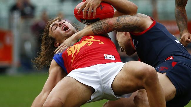 Rhys Mathieson gets tackled high. Picture: Colleen Petch.