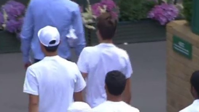 The tennis players were walked off court to change in to white underpants.