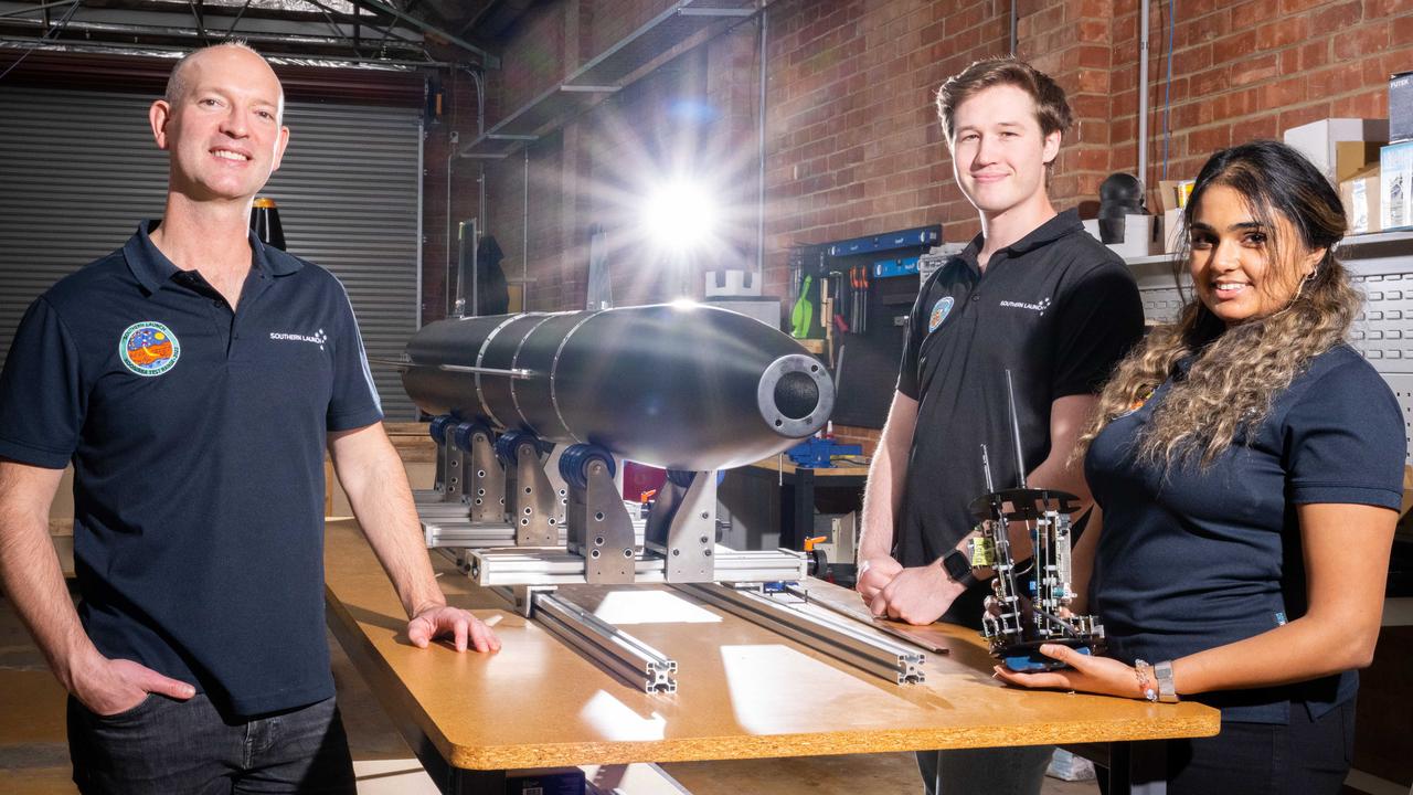 Southern Launch chief executive Lloyd Damp with graduate engineers Matthew Willson and Farisha Jamal at the company’s facility in Hindmarsh. Picture: Morgan Sette