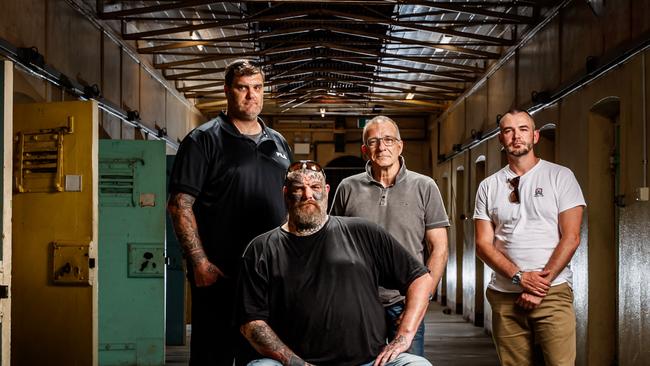 Former Finks MC members Matt and Tyson Ward (sitting), Henry Keogh and Arcofyre Founder and CEO Kirby Brownlow at the old Adelaide Gaol in 2020. Picture Matt Turner.