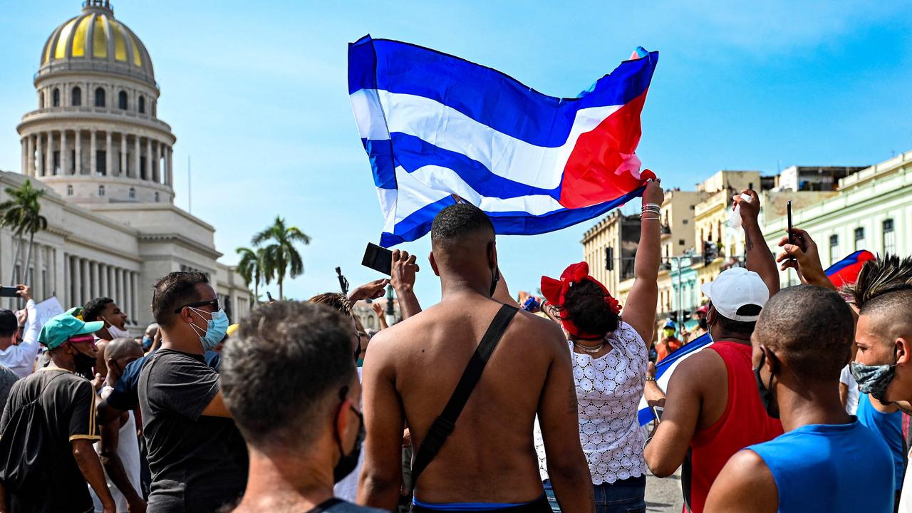 Cuban protesters outside the Capitol in Havana on Sunday. Picture: Yamil Lage/AFP