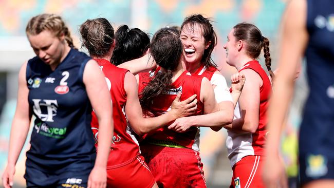 Rachel Archer hugging team mate Melanie Wise after Clarence won the TSLW grand final. Picture: NIKKI DAVIS-JONES