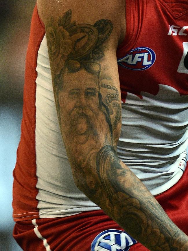 And he has his father tattooed further up on the same arm.