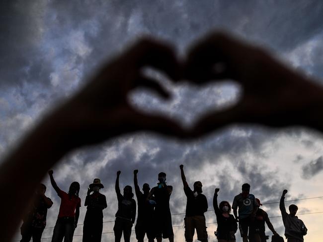 Protesters at a makeshift memorial in honour of George Floyd, on Tuesday in Minneapolis, Minnesota. Picture: CHANDAN KHANNA/AFP