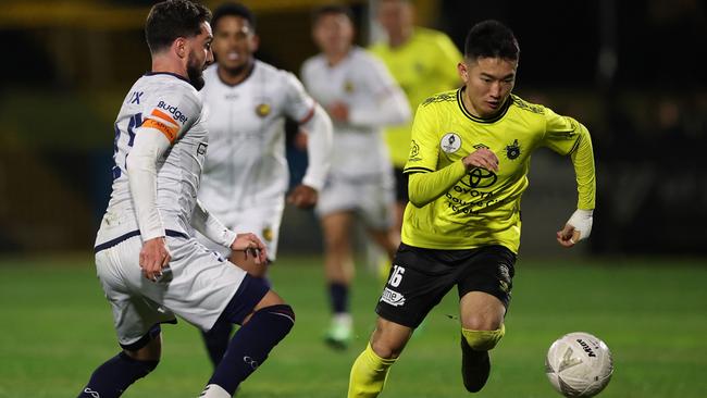 Asahi Yokokawa on the run for Heidelberg United.