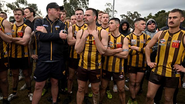 A dejected Rowville group after the match. Picture: Andy Brownbill