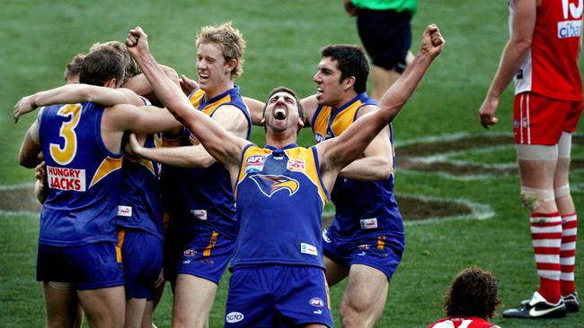 Dean Cox celebrates has been inducted into the Australian football Hall of Fame.