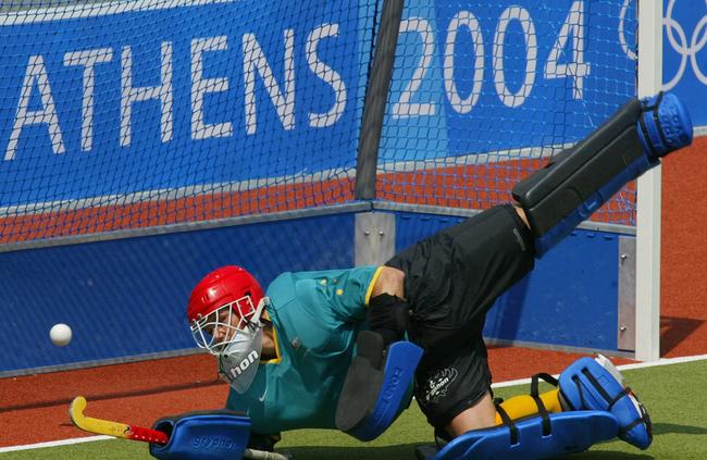 Kookaburras’ goalie Mark Hickman makes a save during Australian team practice in Athens on the eve of the 2004 Olympic Games.