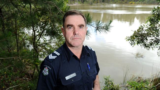 Leading Senior Constable Simon Barker saved the elderly couple from drowning in their submerged car last night. Picture: Andrew Henshaw