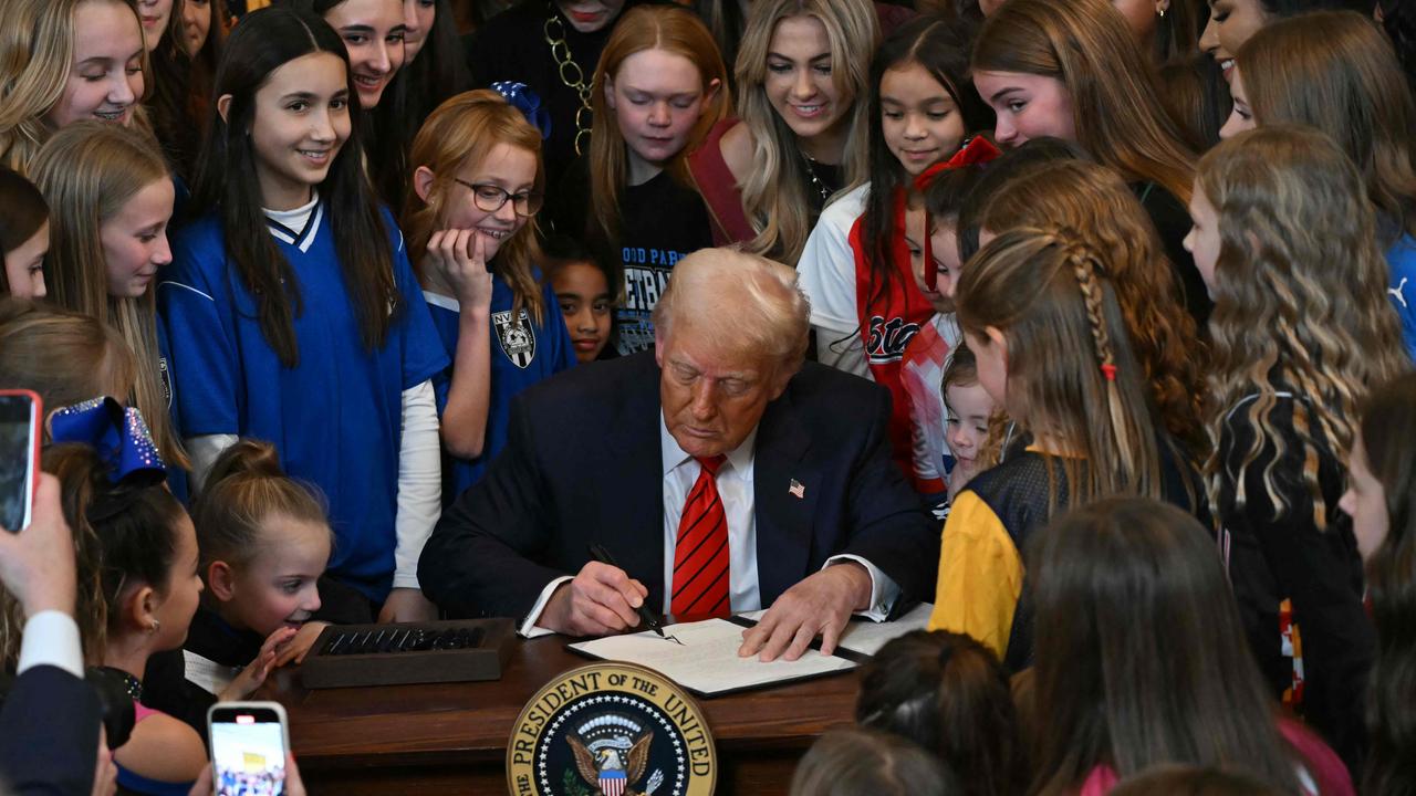 US President Donald Trump signs the No Men in Women's Sports Executive Order into law. (Photo by ANDREW CABALLERO-REYNOLDS / AFP)