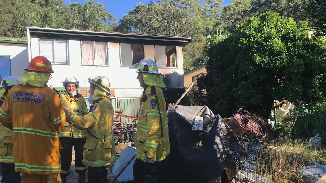 RFS volunteers at the scene of the fire where former bikie Jock Ross managed to drag a man and his dog to safety. Picture: Supplied.