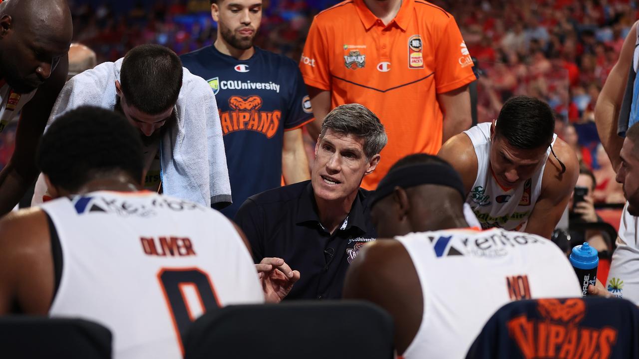 PERTH, AUSTRALIA – MARCH 19: Mike Kelly, head coach of the Taipans addresses his players at a time-out during the NBL match between the Perth Wildcats and the Cairns Taipans at RAC Arena on March 19, 2021, in Perth, Australia. (Photo by Paul Kane/Getty Images)