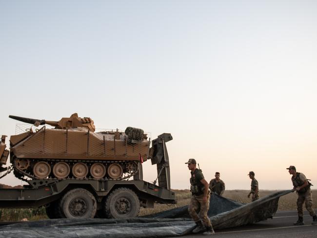 AKCAKALE, TURKEY - OCTOBER 09: Turkish soldiers prepare armored vehicles to cross the border into Syria on October 09, 2019 in Akcakale, Turkey. The military action is part of a campaign to extend Turkish control of more of northern Syria, a large swath of which is currently held by Syrian Kurds, whom Turkey regards as a threat. U.S. President Donald Trump granted tacit American approval to this campaign, withdrawing his country's troops from several Syrian outposts near the Turkish border. (Photo by Burak Kara/Getty Images)