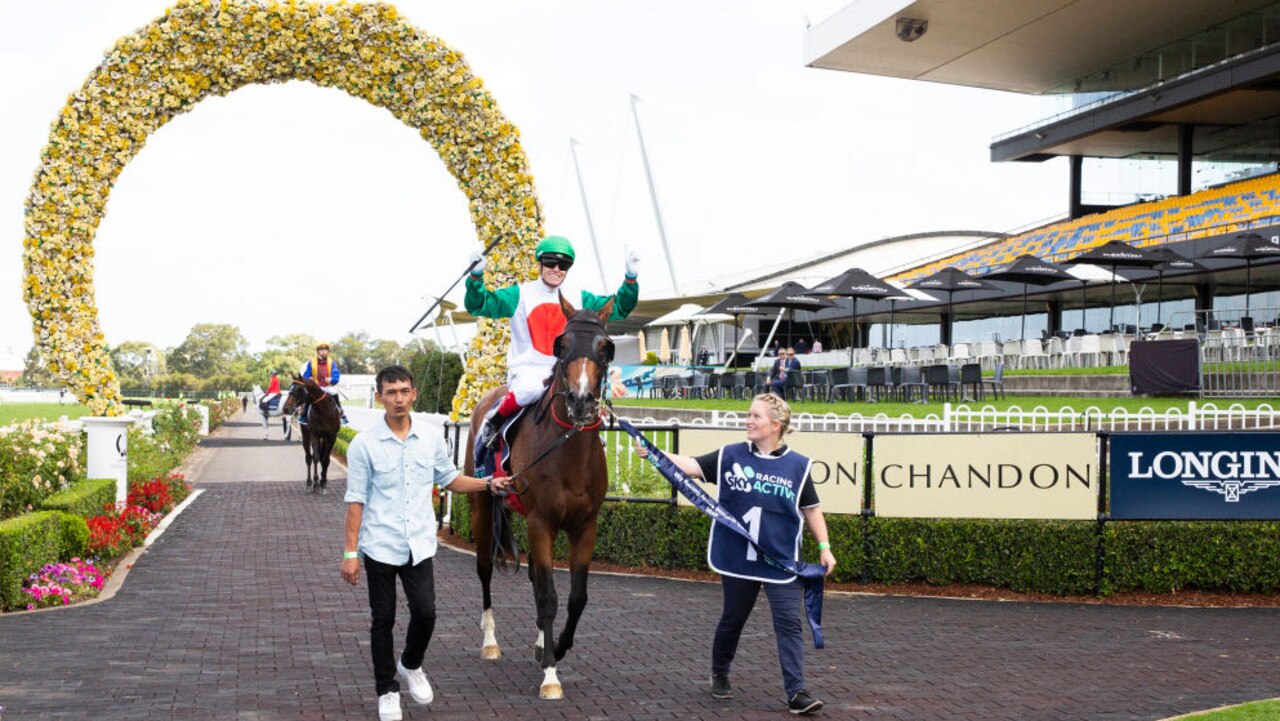SYDNEY, AUSTRALIA - MARCH 21: Craig Williams raises his arms as he returns to scale on Castelvecchio after winning race 6 the Sky Racing Active Rosehill Guineas during 2020 Golden Slipper Day at Rosehill Gardens on March 21, 2020 in Sydney, Australia. (Photo by Jenny Evans/Getty Images)