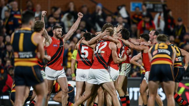 ADELAIDE, AUSTRALIA - APRIL 19: Bombers  celebrate the final siren  during the round six AFL match between Adelaide Crows and Essendon Bombers at Adelaide Oval, on April 19, 2024, in Adelaide, Australia. (Photo by Mark Brake/Getty Images)