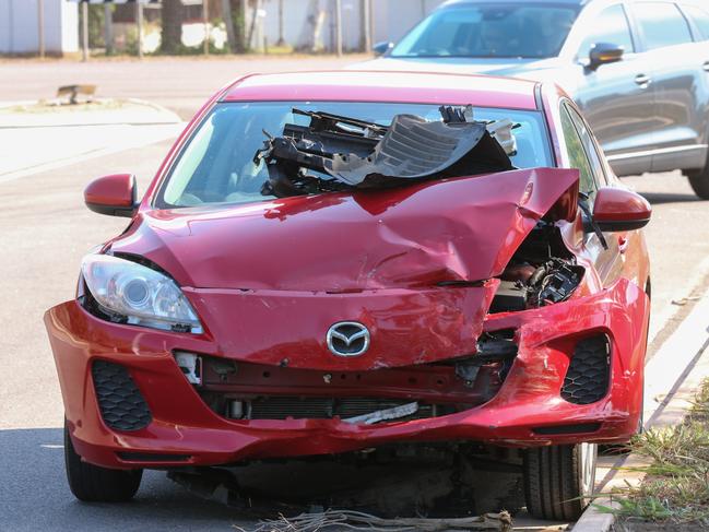 A red car worse for wear following a crash on McMillans Rd and Mueller Rd. Picture: GLENN CAMPBELL
