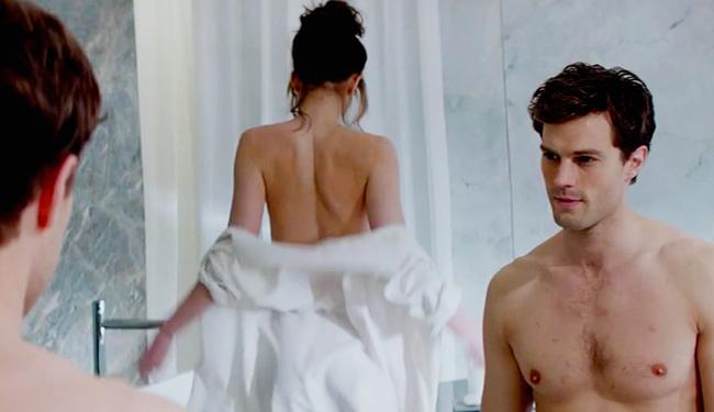 English actor Jamie Dornan takes a shirtless break from his stylish suits in the 50 Shades of Grey movie with Dakota Fanning. Picture: Supplied