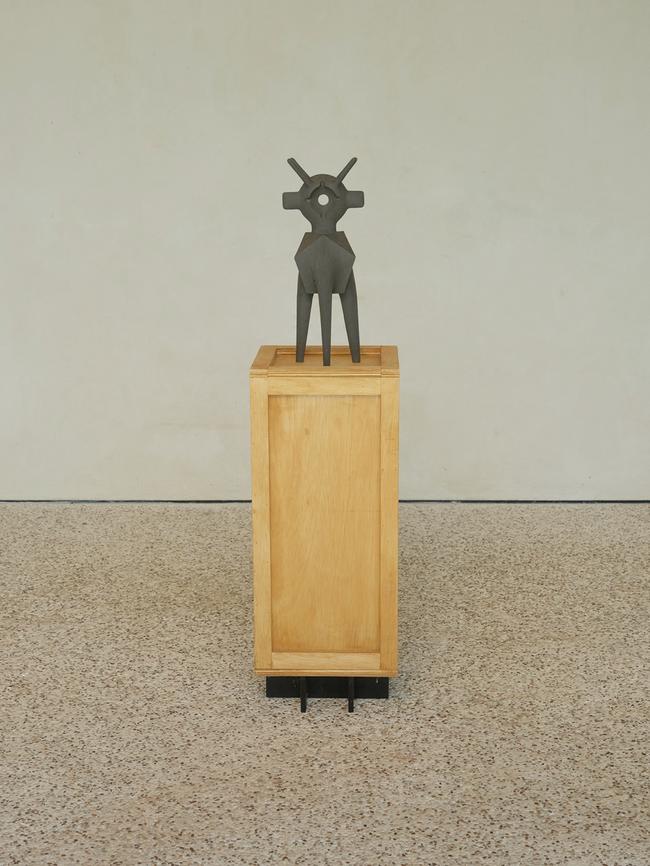 A sculpture by American artist Aleph Geddis on a stand crafted by Gorrow.