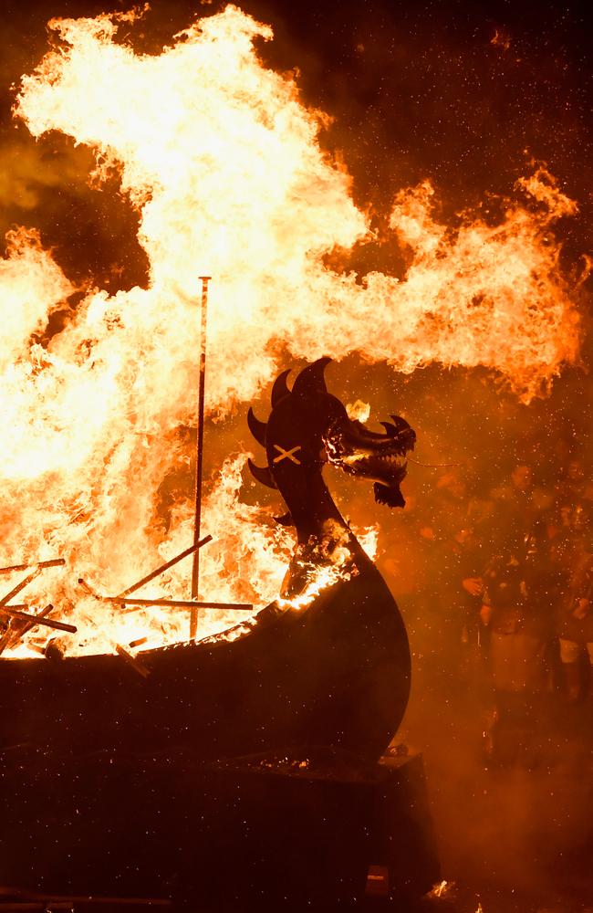 An imitation Viking longship is set alight in Lerwick, Shetland, during the traditional festival of fire, known as Up Helly Aa. Picture: Getty