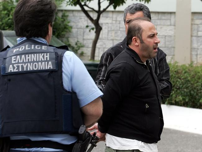 Tony Mokbel is escorted to Athens’ top security prison on May 14, 2008. Picture: AFP