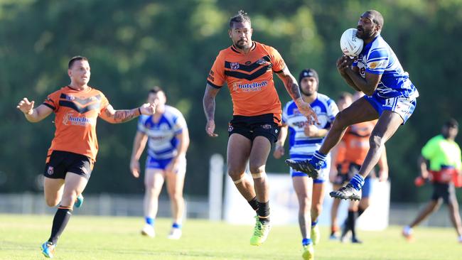 Brothers’ Peter Tuccandidgee flies high for the ball during the 2018 CDRL preliminary final between Brothers Cairns and Tully Tigers at Barlow Park. PICTURE: JUSTIN BRIERTY