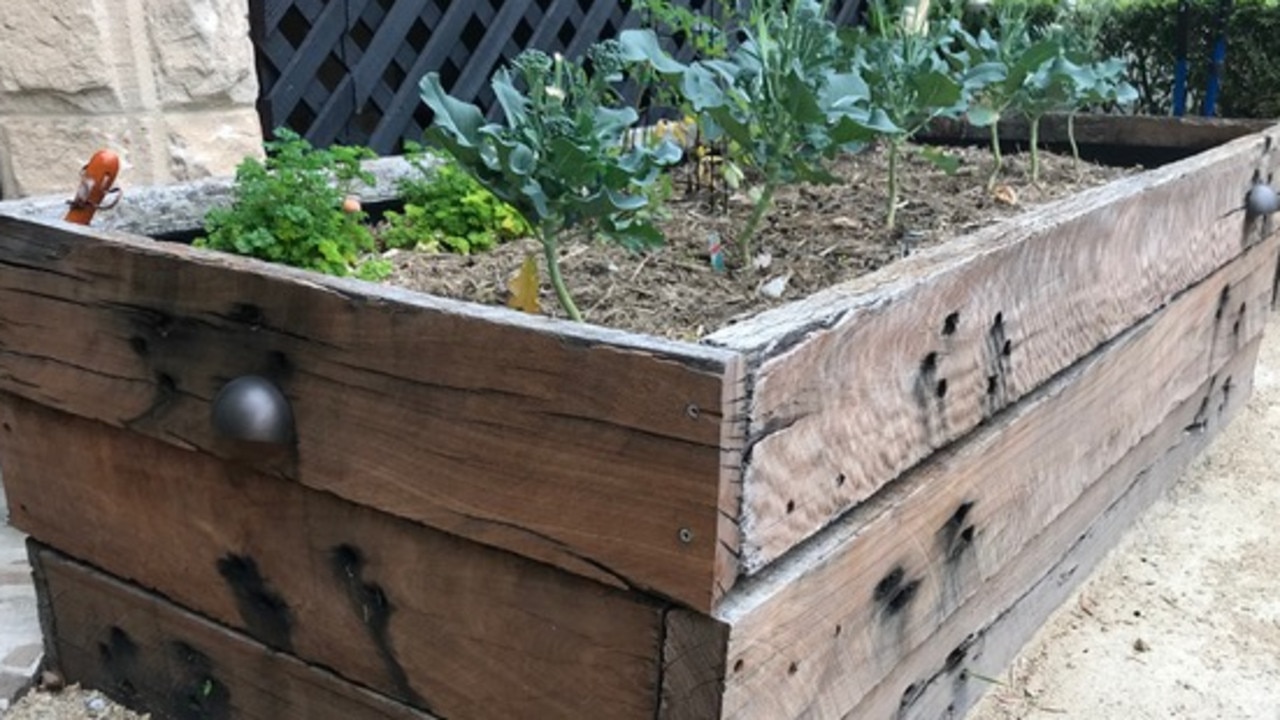 Recycled building materials make for a rustic herb garden. Picture: Supplied