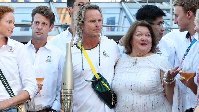 Gina Rinehart hosts athletes and coaches, including Titmus’ coach Dean Boxall, third from left, aboard a celebratory cruise on the Seine River in Paris. Picture: Adam Head