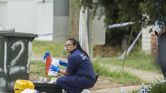 A forensic officer at the crime scene at Livingstone Ave, Dharruk. Picture: Jenny Evans