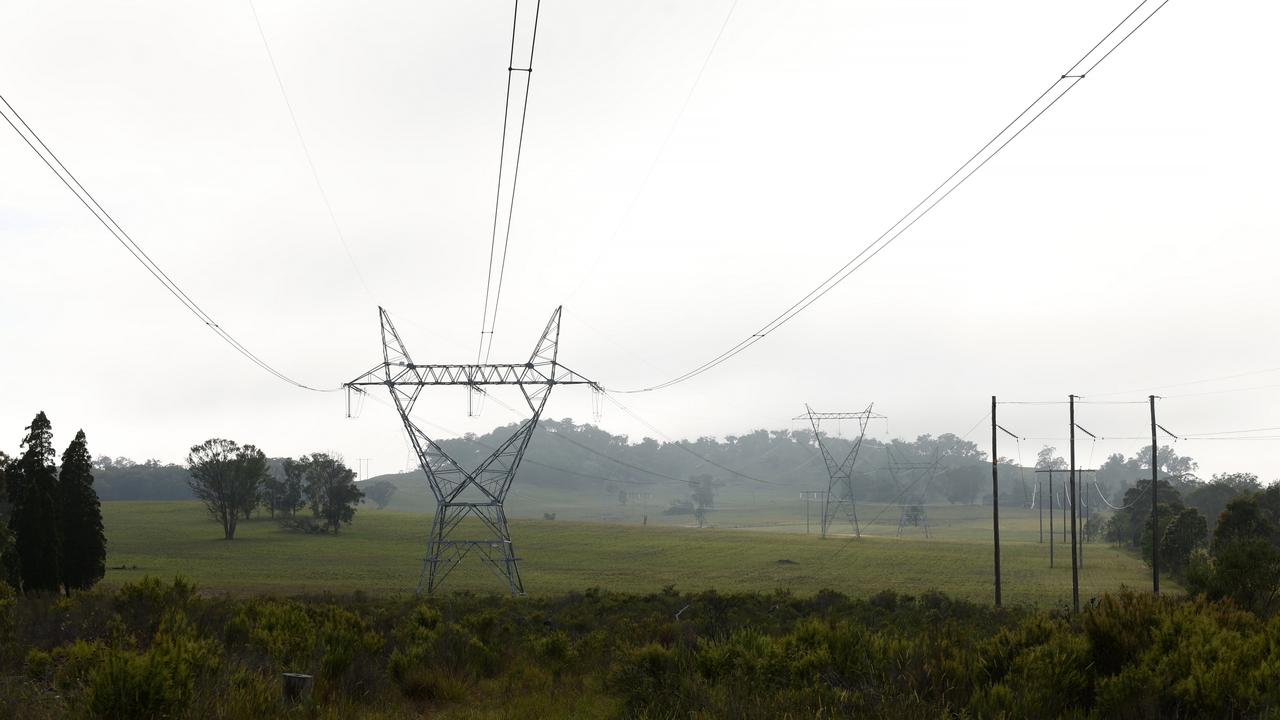 Existing transmission lines on the farm of Andrew Campbell in Stubbo. Mr Campbell will have new larger one built 240 metres from his home. Picture: Jonathan Ng