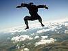  THINKSTOCK - 21.3.2013 - Skydiver sitflying over broken clouds 