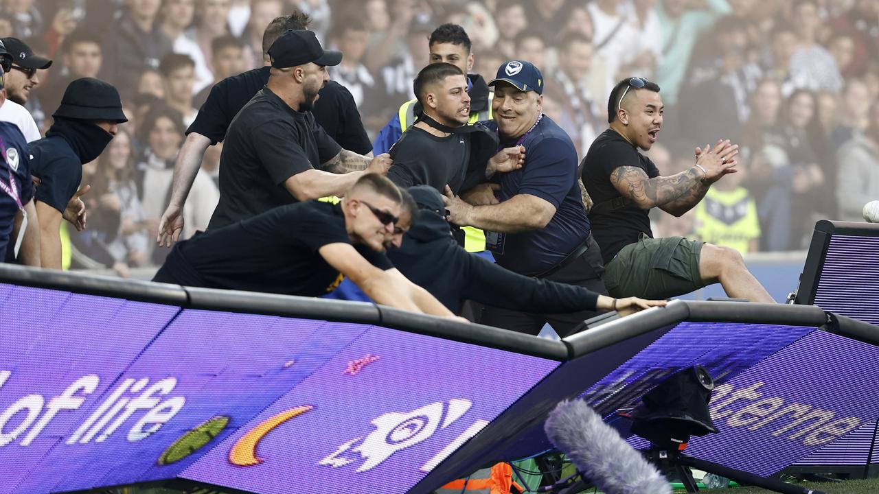 Fans storm the pitch during the round eight A-League Men’s match between Melbourne City and Melbourne Victory. Picture: Darrian Traynor / Getty Images