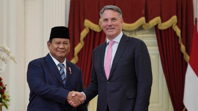 Indonesia's newly sworn-in president, Prabowo Subianto shakes hands with Australia's Deputy Prime Minister Richard Marles during their meeting at Merdeka Palace in Jakarta on October 20, 2024. PIcture: AFP