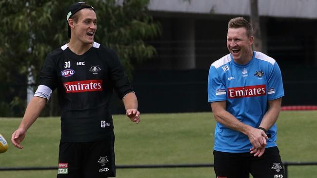 Nathan Buckley and Darcy Moore were in good spirits at training on Friday. Picture: Wayne Ludbey