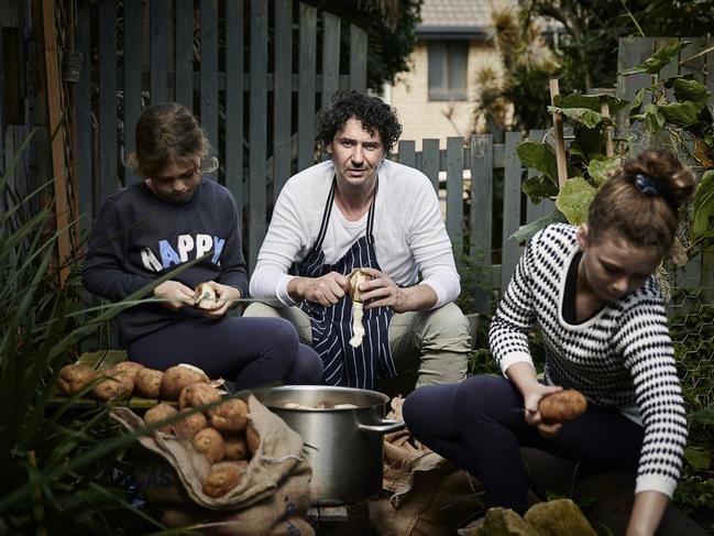 April 2020: Although Colin Fassnidge’s restaurant was closed by COVID-19, he kept busy by providing meals to those less fortunate. Here he peels potatoes with his two daughters in preparation for the evening's soup kitchen. Picture: Rob Palmer/Canon Professional