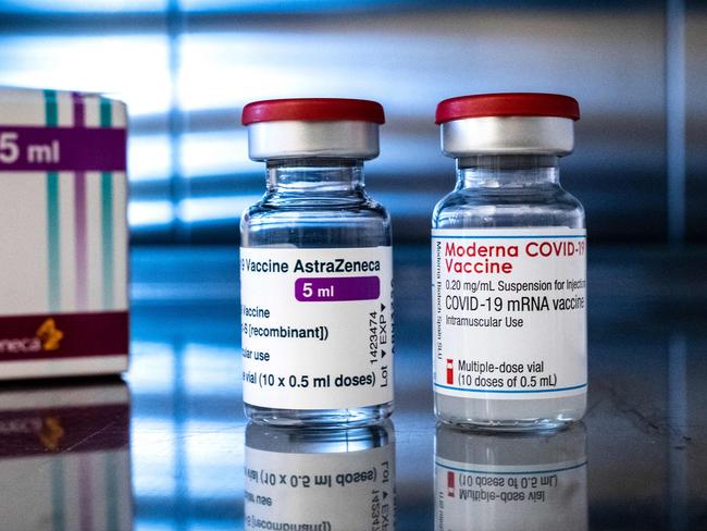 Vials of the AstraZeneca (L) and Moderna Covid-19 vaccines are pictured at the pharmacy of the Sant'Andrea hospital in Vercelli, Piedmont, on April 15, 2021. (Photo by MARCO BERTORELLO / AFP)